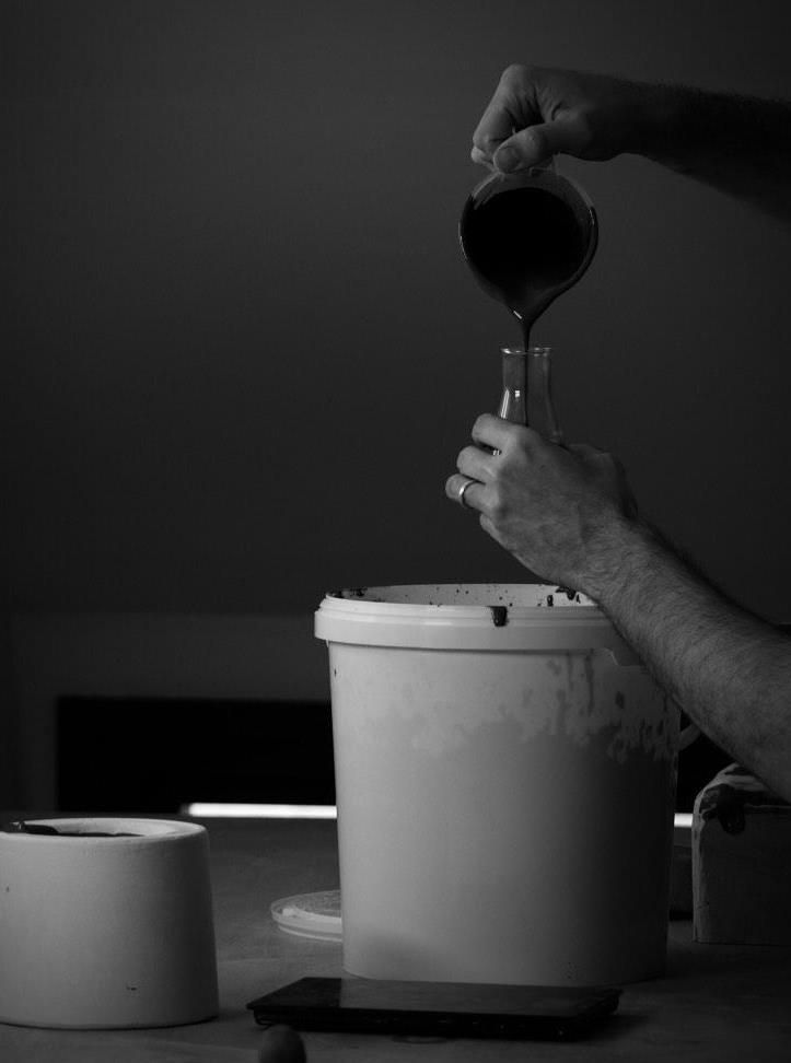 Slip from rescued clay being filtered in the studio.