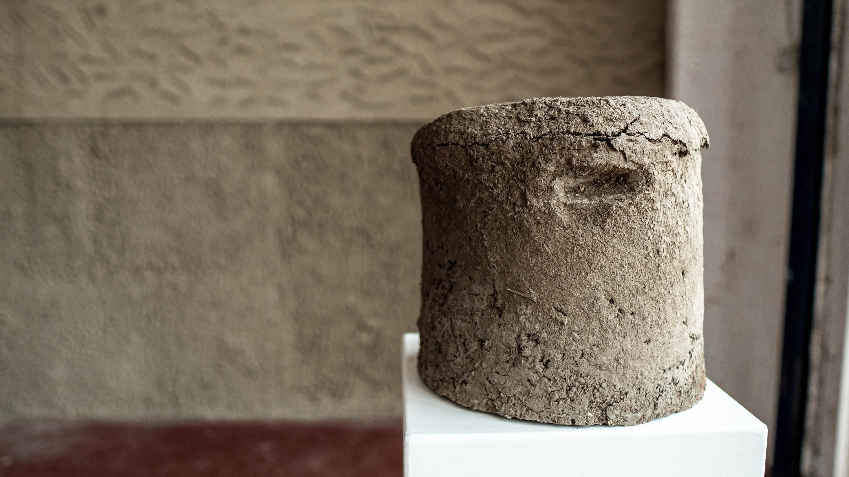A cylinder of urban cob made from rescued London clay, sand, and straw.